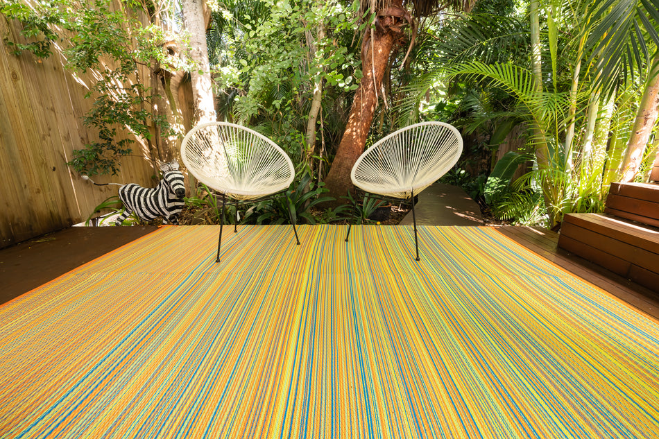 Outdoor rug with geometric patterns on a wooden deck