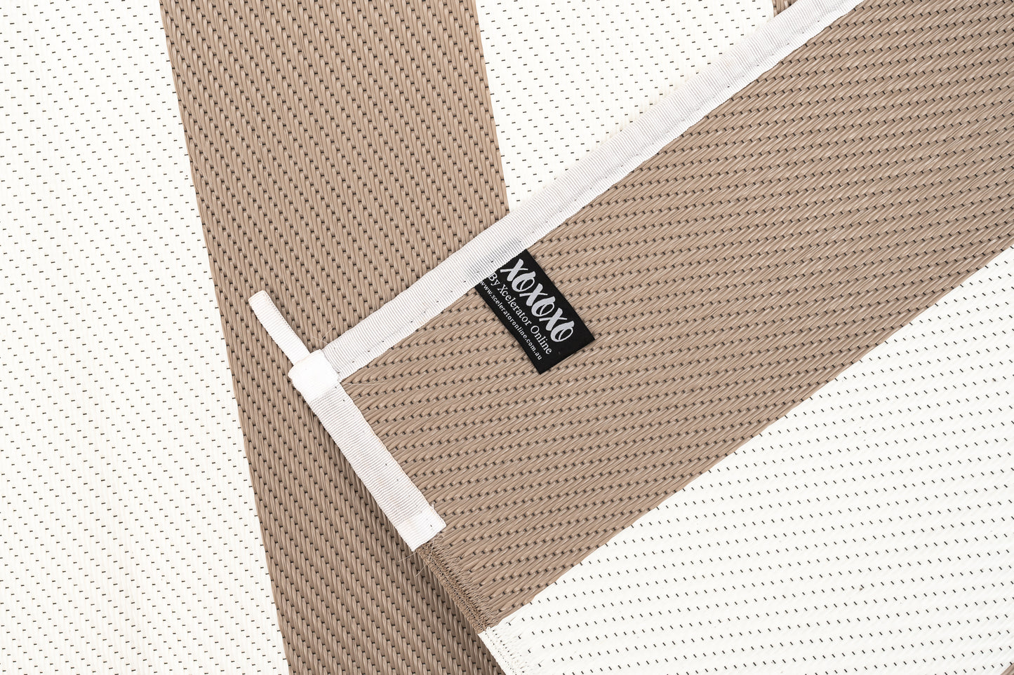 striped beige and white outdoor rug used for camping caravan patio outdoor setup