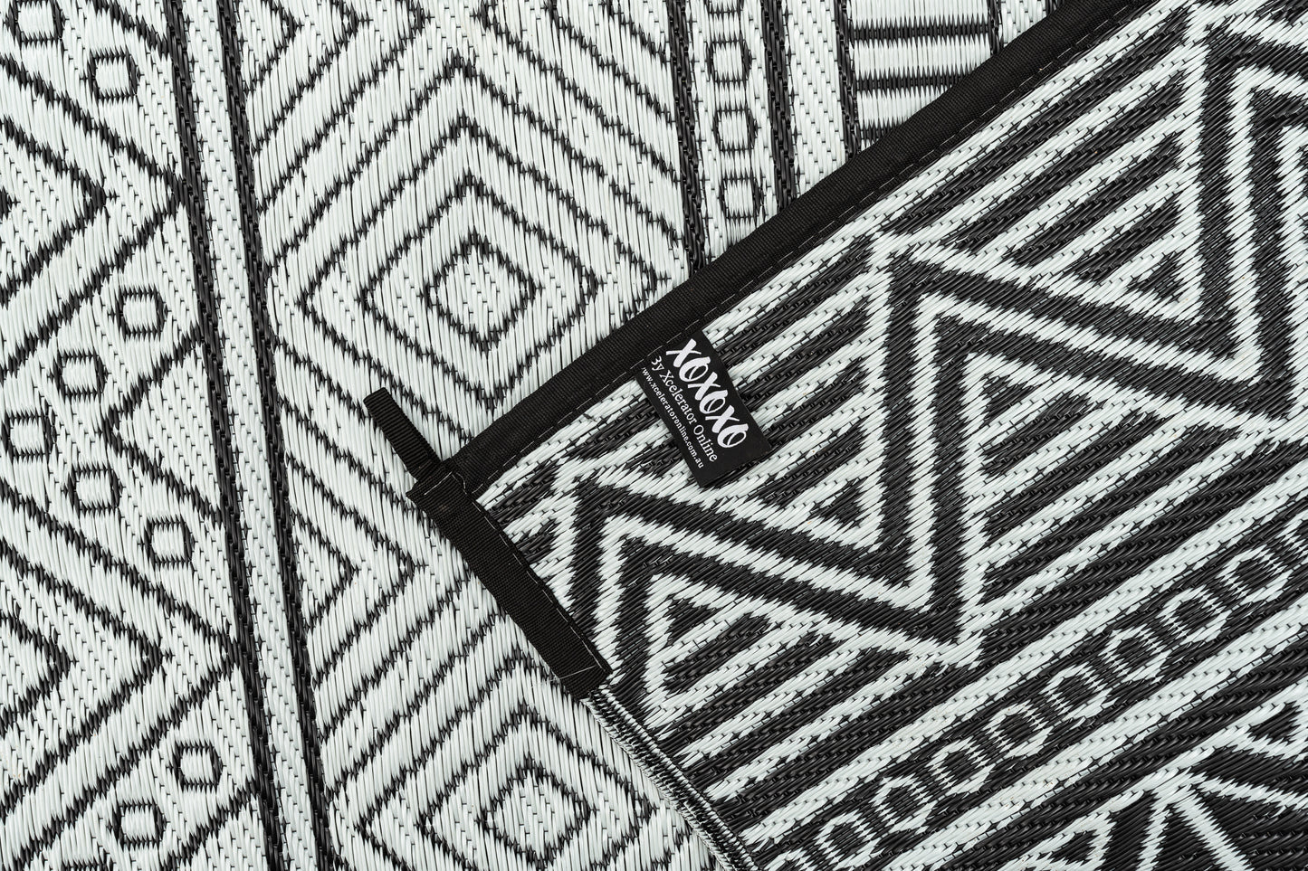 Swazi black outdoor rug folded compact for travel camping mat