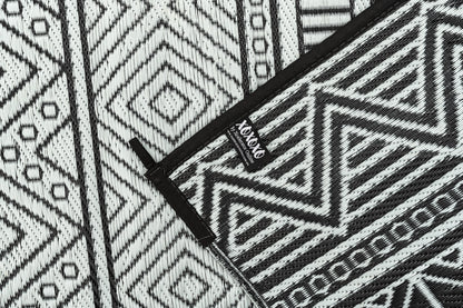 Swazi black outdoor rug folded compact for travel camping mat